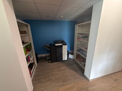 an image of a room with a printer and a cabinet