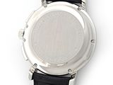an image of a close up of a watch on a white surface