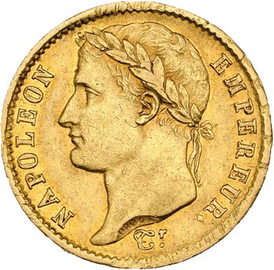 a close up of a gold coin with a woman ' s head on it