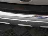 a close up of a car ' s bumper with a sticker on it