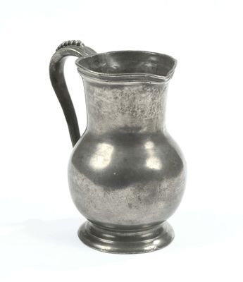 a silver pitcher with a handle on a white background