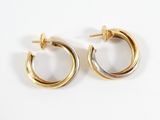 pair of gold and silver hoop earrings on a white background