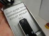 a person holding a metal device in their hand