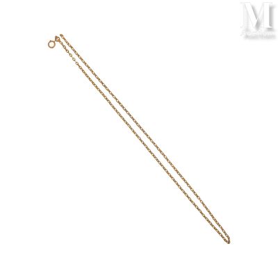 a close up of a gold chain on a white background