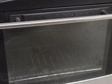 a toaster oven that is sitting on the floor