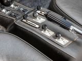 a close up of a car dashboard with buttons and a steering wheel