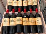 many bottles of red wine in a wooden box