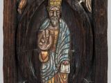 an image of a wooden plaque with an image of a man holding a baby