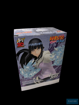 figurine d'anime représentant Naruto dans une boîte, sur fond noir