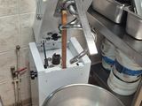 an image of a kitchen with a mixer and a bowl on the floor