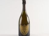 an image of a bottle of champagne sitting on top of a white table