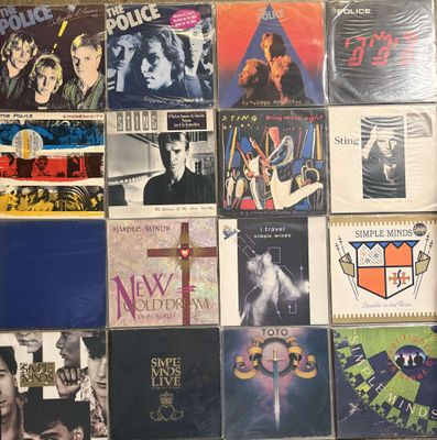 a lot of records on the wall of a room