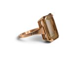 a close up of a ring with a stone on it