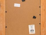 a close up of a picture frame with a piece of paper on it