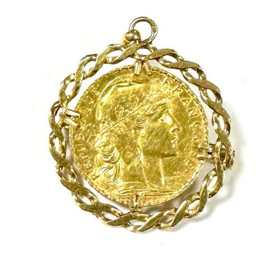 an image of a gold coin with a chain around it on a white surface