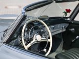 a steering wheel and dashboard of a car with a rose on the steering wheel