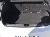 a trunk of a white car with its doors open