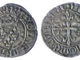 a silver coin with a cross on the front and a crown on the back