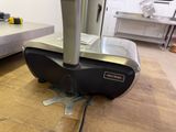 a machine that is sitting on top of a wooden table