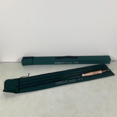 a pair of green pencils sitting on top of a table