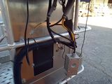 a truck that has a bunch of wires attached to the back of it
