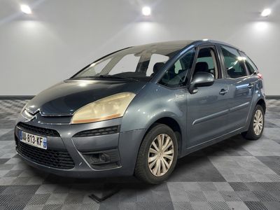 the grey citrole is parked on a checkered floor