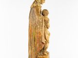 a statue of a woman holding a child in her arms