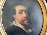portrait d'un homme barbu dans un cadre en or