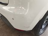 a close up of a white car with a black rim
