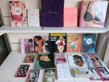 many books on a shelf in a room