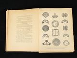 an open book with a drawing of various objects on it