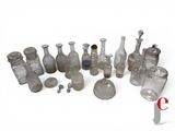 a lot of glass bottles that are sitting on a table