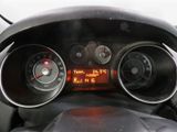 a close up of a car dashboard with a speedometer