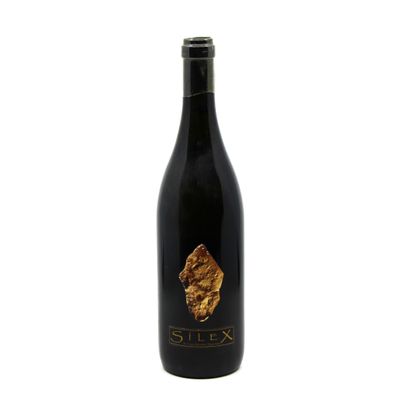 a bottle of wine with a gold leaf on it