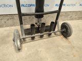 an image of a hand truck with a pipe attached to it