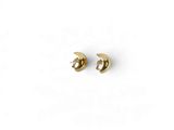 a pair of gold earrings on a white background