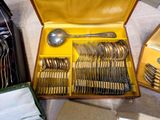 a box with silverware in it on a table