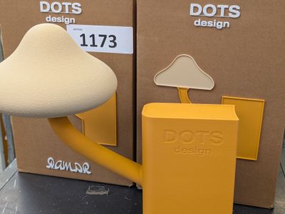 a yellow box with a mushroom on it next to a yellow box with a yellow mushroom on it