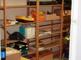 a room that has a lot of shelves and boxes on it