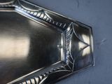 a silver tray with a mirror on it on a table