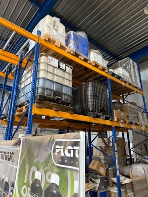 a large amount of pallets stacked on a rack in a warehouse