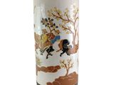a vase with a picture of a man riding a horse on it