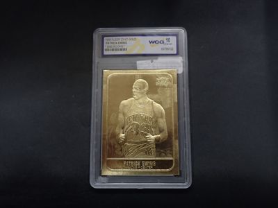 a close up of a piece of gold with a basketball player on it