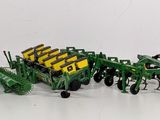 a lot of toy tractors that are sitting on a table