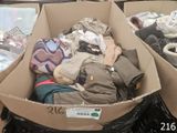 a cardboard box filled with clothes and other items