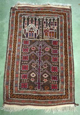 an old rug with a design on it on a green floor