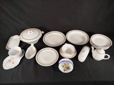 a lot of plates and cups on the table