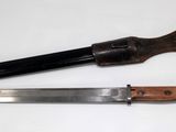 two knives that are sitting next to each other on a table