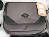 a black and gray bag with a tag on it