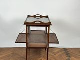 an image of a wooden table with a glass top on a herringle floor